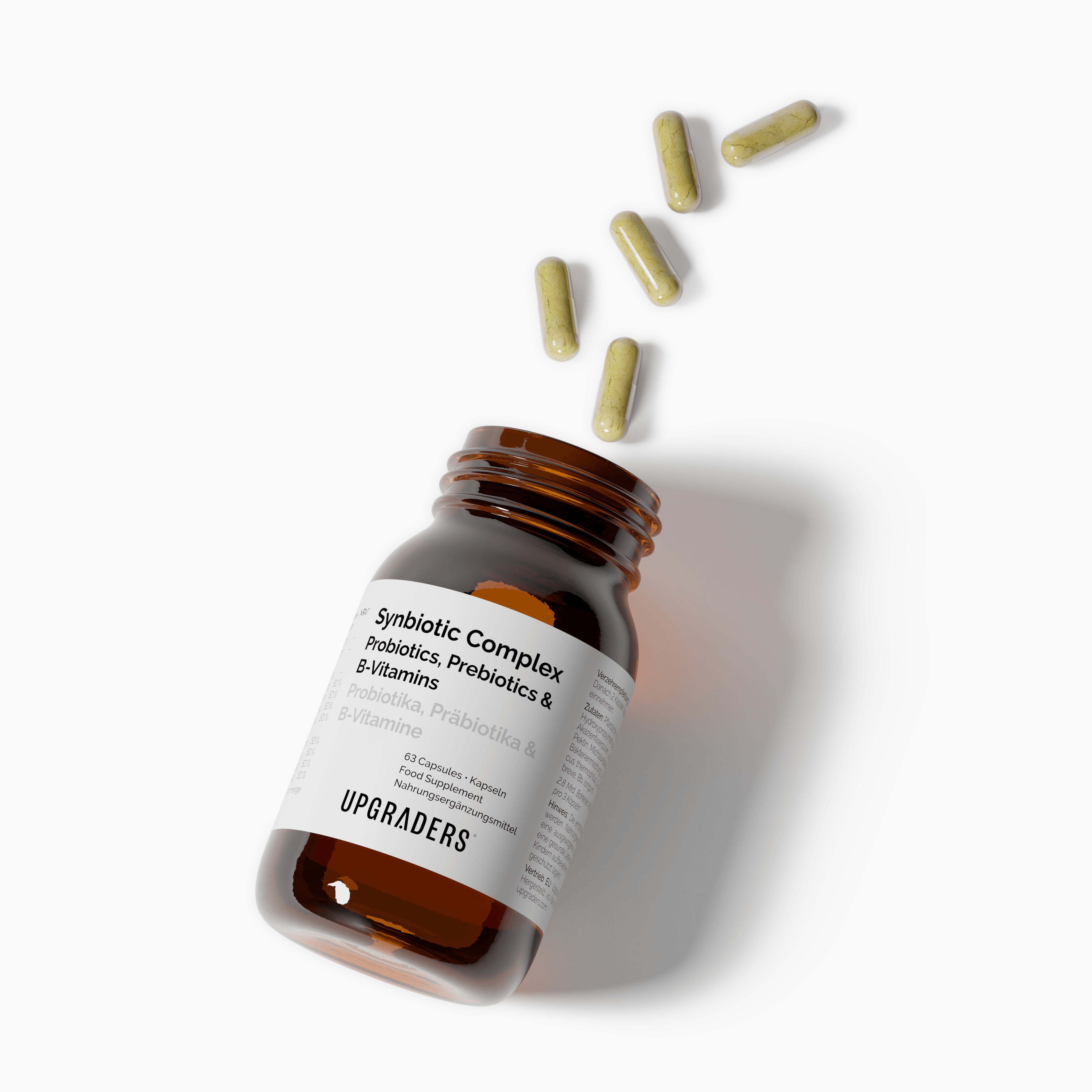 Brown supplement bottle with white label and scattered capsules on a light background